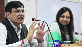 State Information Commissioner Parveen Kumar (left) and MC Additional Commissioner Isha Kalia hold a meeting with the MC staff in Ludhiana on Friday.