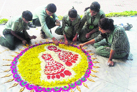 Greenland School (below) make rangolis on the school premises in Ludhiana.
