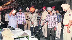 The police conducting checks in Sangrur on Friday. Tribune photo