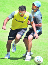 Rohit Sharma and Virat Kohli play football during a practice session at Chinnaswamy Stadium in Bengaluru on Friday.