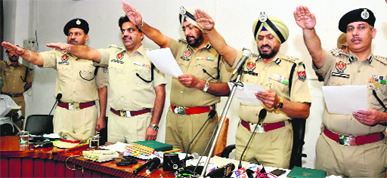 Nirmal Singh Dhillon, IG, Bathinda zone, (second from right) administers oath to senior police functionaries to eradicate the menace of drugs in their respective areas, at the District Administrative Complex in Bathinda on Saturday.