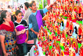 Residents buy idols of Lord Ganesha and Goddess Lakshmi at Sector 22 on Saturday.