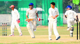 Players of Delhi Public School, Mathura Road, steal a run against Yadavindra Public School, Mohali, during an Indian Public Schools Conference Cricket League tie in Mohali on Saturday.