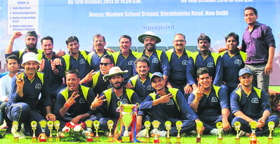 The Punjab and Haryana High Court cricket team strike a pose with the winners cup in New Delhi.