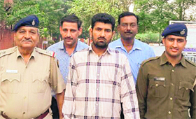 The accused in police custody.