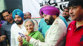 Chief Minister Sheila Dikshit with other Congress leaders launches a DVD of campaign song in New Delhi on Saturday.
