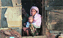 A Rohingya Muslim with her child in a shanty on the outskirts of Jammu city