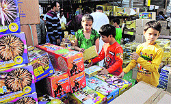 Children select crackers at a market in Jammu on Saturday