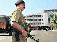 A security guard keeps vigil at the civil secretariat in Jammu
