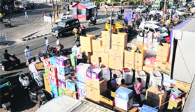 Shopkeepers wares placed near the road in Jammu on Saturday.