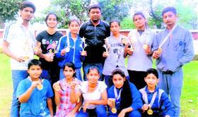 Winners from the Ranbir Institute of Martial Art display their medals in Jammu on Saturday.