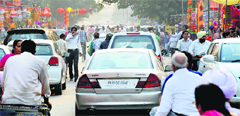 A policeman manages traffic at Ghumar Mandi in Ludhiana on the eve of Diwali on Saturday. Photo: Inderjeet Verma