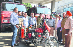 ADFO Bhupinder Singh Sandhu (left) gives instructions to his staff at a fire station in Ludhiana on Saturday. photo: inderjeet verma