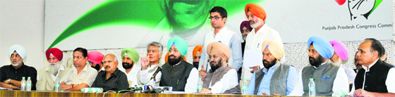 In an apparent show of strength, PPCC chief Partap Bajwa (5th from right) addresses the media in the presence of MLAs and other leaders at the Congress Bhawan in Chandigarh on Saturday. Tribune photo: Pradeep Tewari 