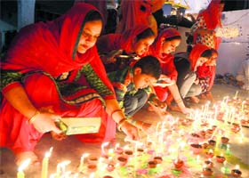 Devotees light candles on the occasion of Diwali and Bandi Chhod Diwas at Guru Arjan Dev Gurdwara, Dhillon Colony, in Bathinda on Sunday evening