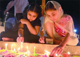 Girls light up candles