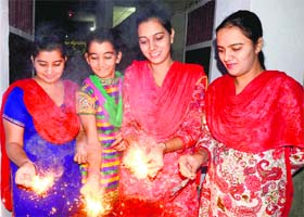 A family enjoys crackers on Diwali in Bathinda