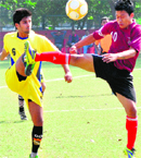 Players in action during a match at the Sector 17 football stadium in Chandigarh on Monday. Tribune photo: S Chandan