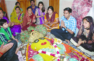 Devotees participating in Govardhan Maharaj Puja, organised by the Yuva Sanskritik Sangathan at Ghantaghar in the Capital on Monday. 