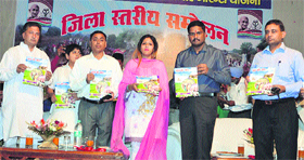 Avantika Maken Tanwar (centre) with DC J Ganesan (left) and ADC Shiv Prashad Sharma (right) release a book on MGNREGA during a convention in Sirsa on Friday.
