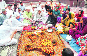 Devotees offer prayers on the occasion of Govardhan puja in Gurgaon on Monday.