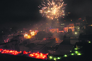 An illuminated Jalandhar city with lights and firecrackers on Diwali night. 