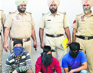 The three accused of stealing  fabric bundles in police custody in Jalandhar on Monday.