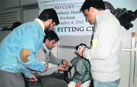 Prosthetic hands being provided to amputees in Srinagar on Monday.