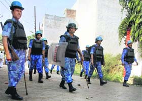 RAF jawans patrol the streets after a boy was shot dead on Diwali in Muzaffarnagar on Monday