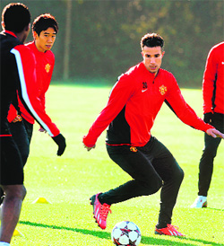 Manchester Uniteds Robin van Persie attends a training session on the eve of their Champions League group A match against Real Sociedad in Spain. 