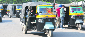Autos bearing Punjab registration numbers at Sector 22, Chandigarh.