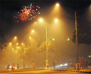 A street filled with smoke on Diwali night. 