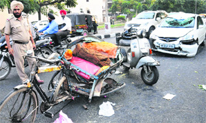 A rickshaw that collided with a car on the road separating Sectors 31 and 32 in Chandigarh on Tuesday.