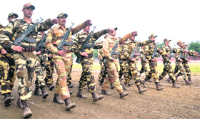 A police contingent holds a rehearsal for the statehood day function at the Police Lines in Dehradun on Tuesday.