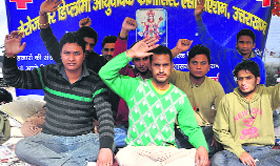 Members of the unemployed diploma ayurvedic pharmacists' body protest at the Parade Ground in Dehradun on Tuesday.