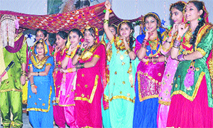 Students of Gurukul School perform giddha during a prize distribution function in Jalandhar on Tuesday. A Tribune photograph