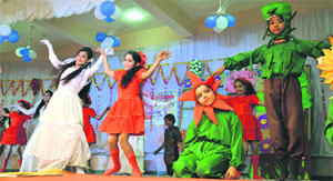 Flowers blossom: Students of Atam Jain School tap feet during a function in Ludhiana