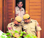 A Delhi Police team comes out from the residence of BSP MP Dhananjay Singh in New Delhi on Tuesday. Tribune photo: Mukesh Aggarwal