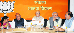 BJP senior leader LK Advani (centre) at a party meeting in New Delhi on Tuesday. Tribune photo: Mukesh Aggarwal 