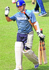Sachin Tendulkar walks out for a practice session at Eden Gardens, on the eve of the first of the two-test series against West Indies, on Tuesday.