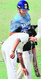 A youngster seeks blessing from Sachin