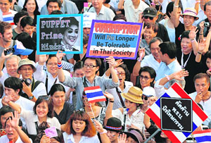 Thai students and teachers of Chulalongkorn University hold a protest rally against the governments political amnesty bill in Bangkok on Tuesday.