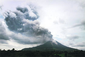 A giant plume of ash rises from the Mount Sinabung volcano during an eruption as seen from Karo district on Indonesia's Sumatra island on Tuesday