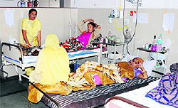 Patients admitted to a ward of Bebe Nanki Mother and Child Care Centre use own beds in Amritsar