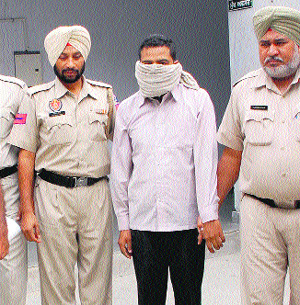 Pal Singh in police custody in Bathinda on Wednesday.