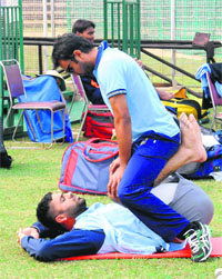 Players of Punjab and Mumbai teams during a practice session at Cricket Stadium in Sector 16, Chandigarh, on Wednesday. 