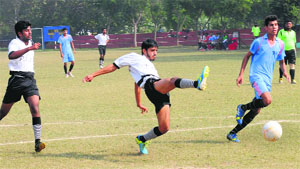 Players in action during a match of the Chandigarh Institutional Football League Championship at Football Stadium in Sector 17, Chandigarh, on Wednesday.