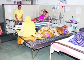 Patients admitted to a ward of Bebe Nanki Mother and Child Care Centre use own beds in Amritsar