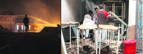 A firefighter extinguishes fire at Lal Ded Hospital, and (right) damage caused to the hospital in Srinagar. 