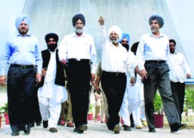 Rural Development Minister Surjit Singh Rakhra with officials at the Rajpura Thermal Plant on Wednesday